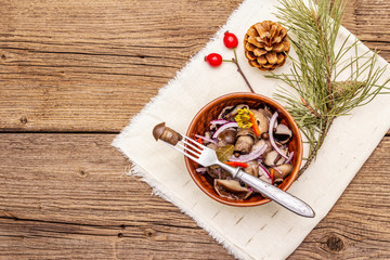 Pickled (fermented) mushrooms. Traditional New Year (Christmas) snack. Festive table cutlery setting