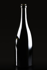 Black glass bottle for champagne wine isolated on black background