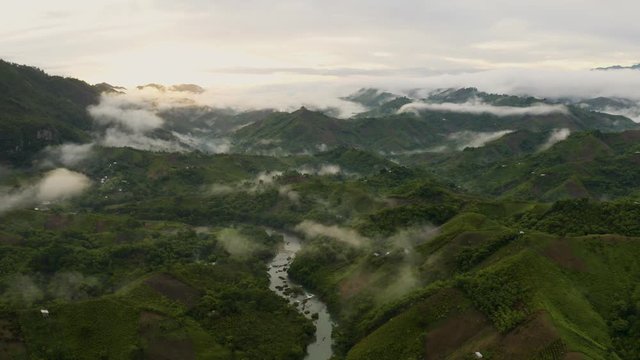 Aerial of Semuc Champey river at foggy sunrise, Guatemala.Pan left 4k.