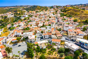 Fototapeta premium Cyprus. Pissouri. Apartment in Cyprus. The streets of the village of Pissouri. Mediterranean village top view. Motor road. Panorama of the Mediterranean city. Cruise. Sunny day in Cyprus