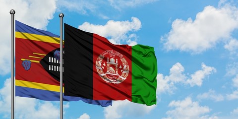Swaziland and Afghanistan flag waving in the wind against white cloudy blue sky together. Diplomacy...