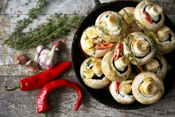 Large mushrooms marinated in mustard sauce with spices before baking. Roasting whole mushrooms. Selective focus. Macro.