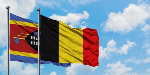 Swaziland and Belgium flag waving in the wind against white cloudy blue sky together. Diplomacy concept, international relations.