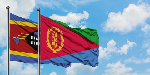 Swaziland and Eritrea flag waving in the wind against white cloudy blue sky together. Diplomacy concept, international relations.