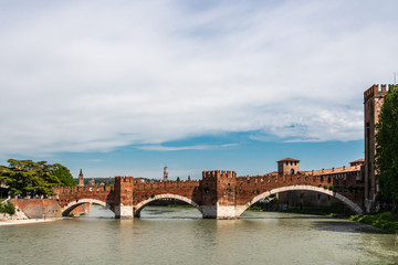 Medieval bridge made of bricks over river in Verona