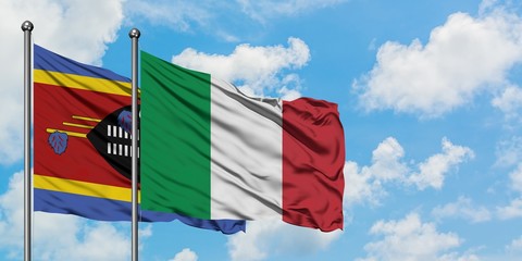 Swaziland and Italy flag waving in the wind against white cloudy blue sky together. Diplomacy concept, international relations.