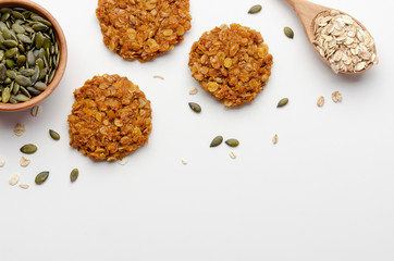 Pumpkin vegan oatmeal cookies with nuts on white background