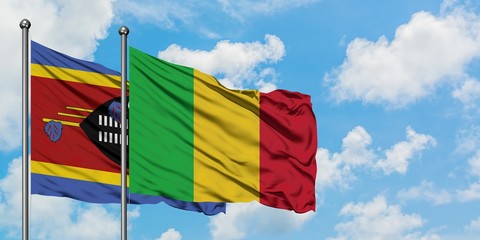Swaziland and Mali flag waving in the wind against white cloudy blue sky together. Diplomacy concept, international relations.