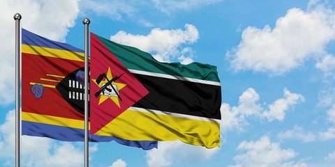 Swaziland and Mozambique flag waving in the wind against white cloudy blue sky together. Diplomacy concept, international relations.
