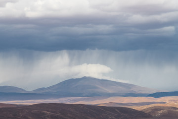 Fototapeta premium Flash Rainstorm in the Andes at San Pedro de Atacama