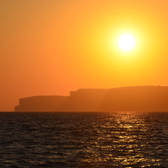 Sunset over Gozo island, Malta