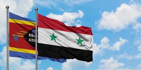 Swaziland and Syria flag waving in the wind against white cloudy blue sky together. Diplomacy concept, international relations.