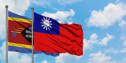 Swaziland and Taiwan flag waving in the wind against white cloudy blue sky together. Diplomacy concept, international relations.