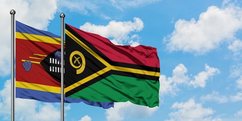 Swaziland and Vanuatu flag waving in the wind against white cloudy blue sky together. Diplomacy concept, international relations.