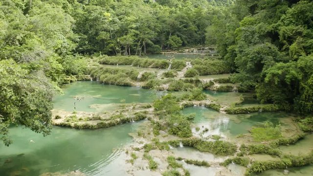Flying over Semuc Champey, Guatemala during Daytime. Horizontal drone 4k.