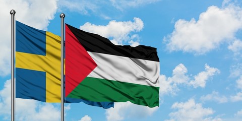 Sweden and Palestine flag waving in the wind against white cloudy blue sky together. Diplomacy concept, international relations.
