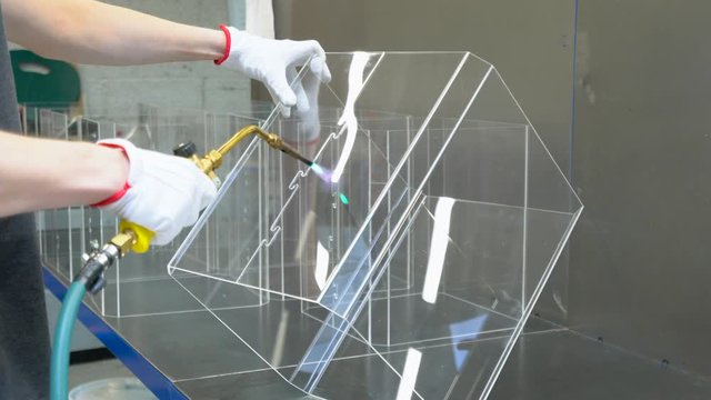 Man heating the plastic with the gas torch