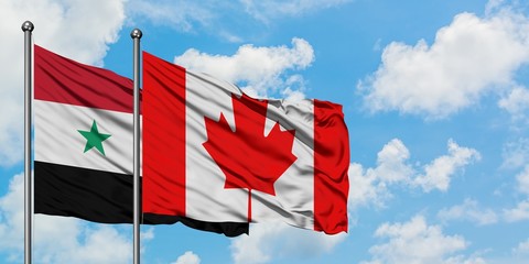 Syria and Canada flag waving in the wind against white cloudy blue sky together. Diplomacy concept, international relations.