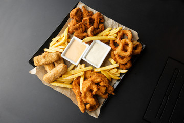 Snack platter - cheese sticks, chicken nugget, onion rings, potato croquette mix of snacks and...