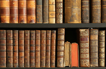 old books on wooden shelf