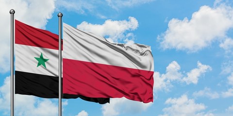 Syria and Poland flag waving in the wind against white cloudy blue sky together. Diplomacy concept,...