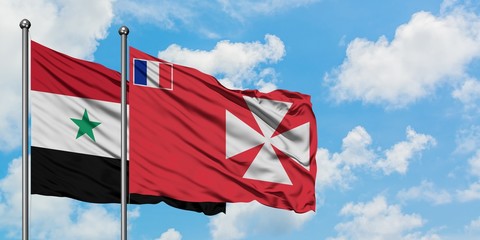 Syria and Wallis And Futuna flag waving in the wind against white cloudy blue sky together....