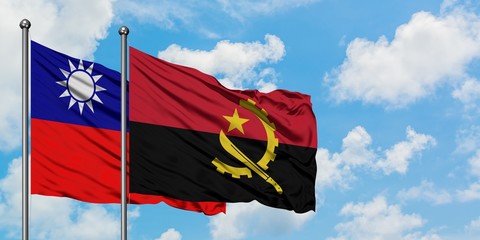 Taiwan and Angola flag waving in the wind against white cloudy blue sky together. Diplomacy concept, international relations.