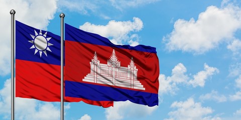 Taiwan and Cambodia flag waving in the wind against white cloudy blue sky together. Diplomacy concept, international relations.