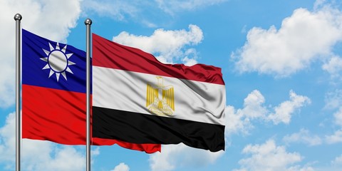 Naklejka na ściany i meble Taiwan and Egypt flag waving in the wind against white cloudy blue sky together. Diplomacy concept, international relations.