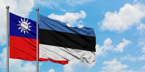 Taiwan and Estonia flag waving in the wind against white cloudy blue sky together. Diplomacy concept, international relations.