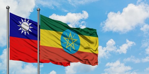 Taiwan and Ethiopia flag waving in the wind against white cloudy blue sky together. Diplomacy concept, international relations.