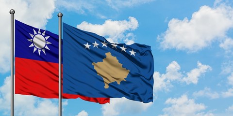 Taiwan and Kosovo flag waving in the wind against white cloudy blue sky together. Diplomacy concept, international relations.