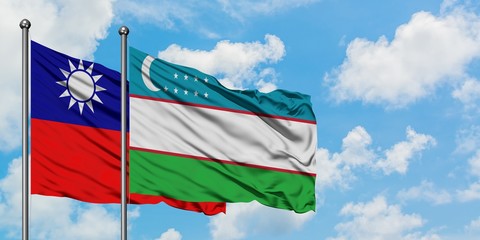 Taiwan and Uzbekistan flag waving in the wind against white cloudy blue sky together. Diplomacy concept, international relations.