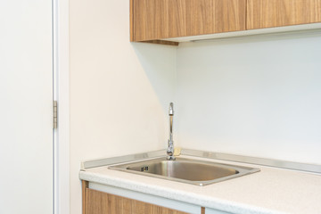 Water faucet and sink decoration in the kitchen interior