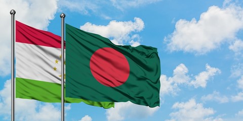 Tajikistan and Bangladesh flag waving in the wind against white cloudy blue sky together. Diplomacy concept, international relations.