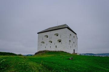 Fototapeta na wymiar Medieval Kristiansten Fortress, located on a hill east of the city of Trondheim. Norway touristic attractions. July 2019