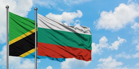 Tanzania and Bulgaria flag waving in the wind against white cloudy blue sky together. Diplomacy concept, international relations.