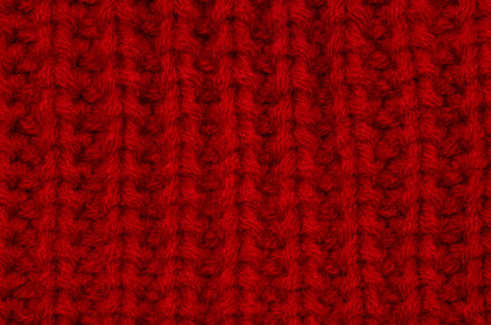 Knitted Red Blanket Macro Texture. Cozy Winter Backdrop.