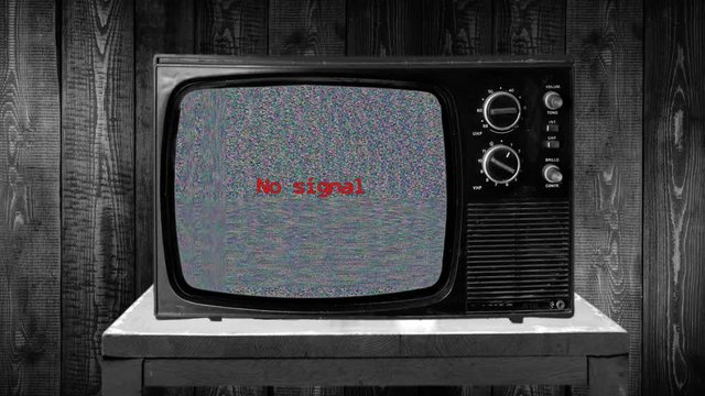 NO SIGNAL static TV and blue screen bug, on retro television set, VHS no tape