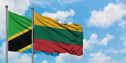 Tanzania and Lithuania flag waving in the wind against white cloudy blue sky together. Diplomacy concept, international relations.