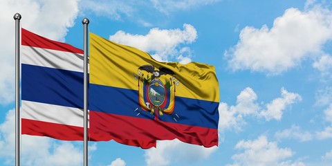 Thailand and Ecuador flag waving in the wind against white cloudy blue sky together. Diplomacy concept, international relations.