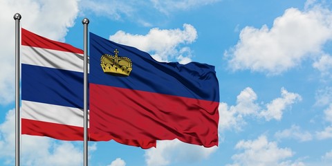 Fototapeta na wymiar Thailand and Liechtenstein flag waving in the wind against white cloudy blue sky together. Diplomacy concept, international relations.