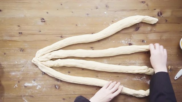 Flat lay. Step by step. Beading dough to bake fresh challah bread.