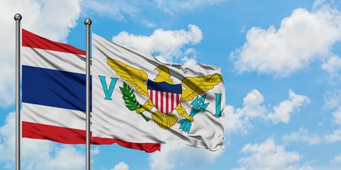 Thailand and United States Virgin Islands flag waving in the wind against white cloudy blue sky together. Diplomacy concept, international relations.