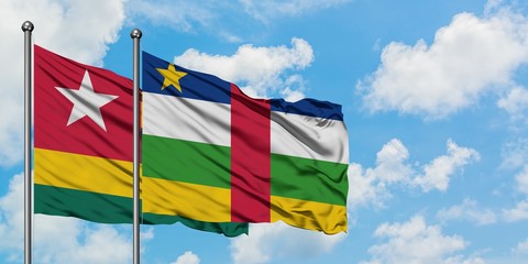 Togo and Central African Republic flag waving in the wind against white cloudy blue sky together. Diplomacy concept, international relations.