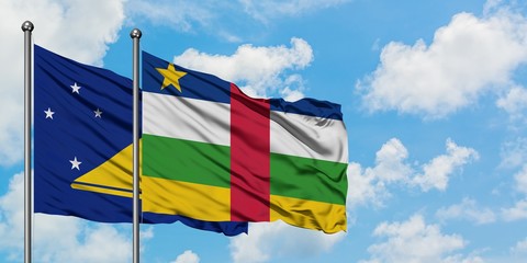 Tokelau and Central African Republic flag waving in the wind against white cloudy blue sky together. Diplomacy concept, international relations.