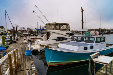 Fototapeta na wymiar Fishing boats on pier of Jamaica Bay, Brooklyn