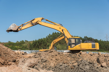 Close-up of a large excavator under construction excavation