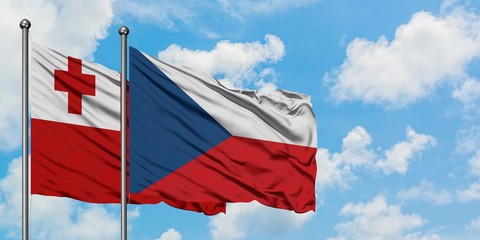 Tonga and Czech Republic flag waving in the wind against white cloudy blue sky together. Diplomacy concept, international relations.