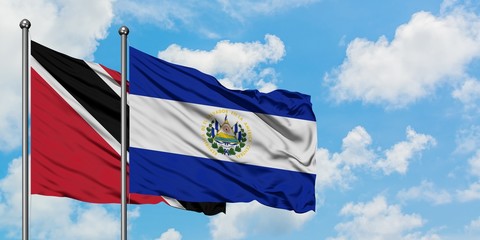 Trinidad And Tobago and El Salvador flag waving in the wind against white cloudy blue sky together. Diplomacy concept, international relations.